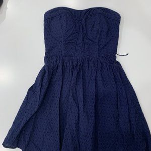 Navy blue strapless eyelet mini dress with boning